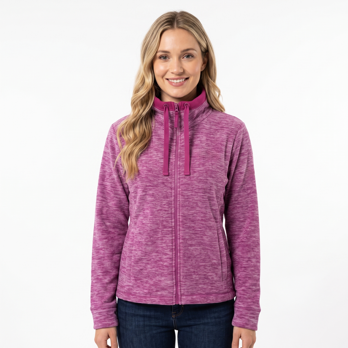A woman wearing a heathered magenta zip-up hoodie with a mock neck and drawstrings, paired with dark blue jeans, photographed against a solid white background.