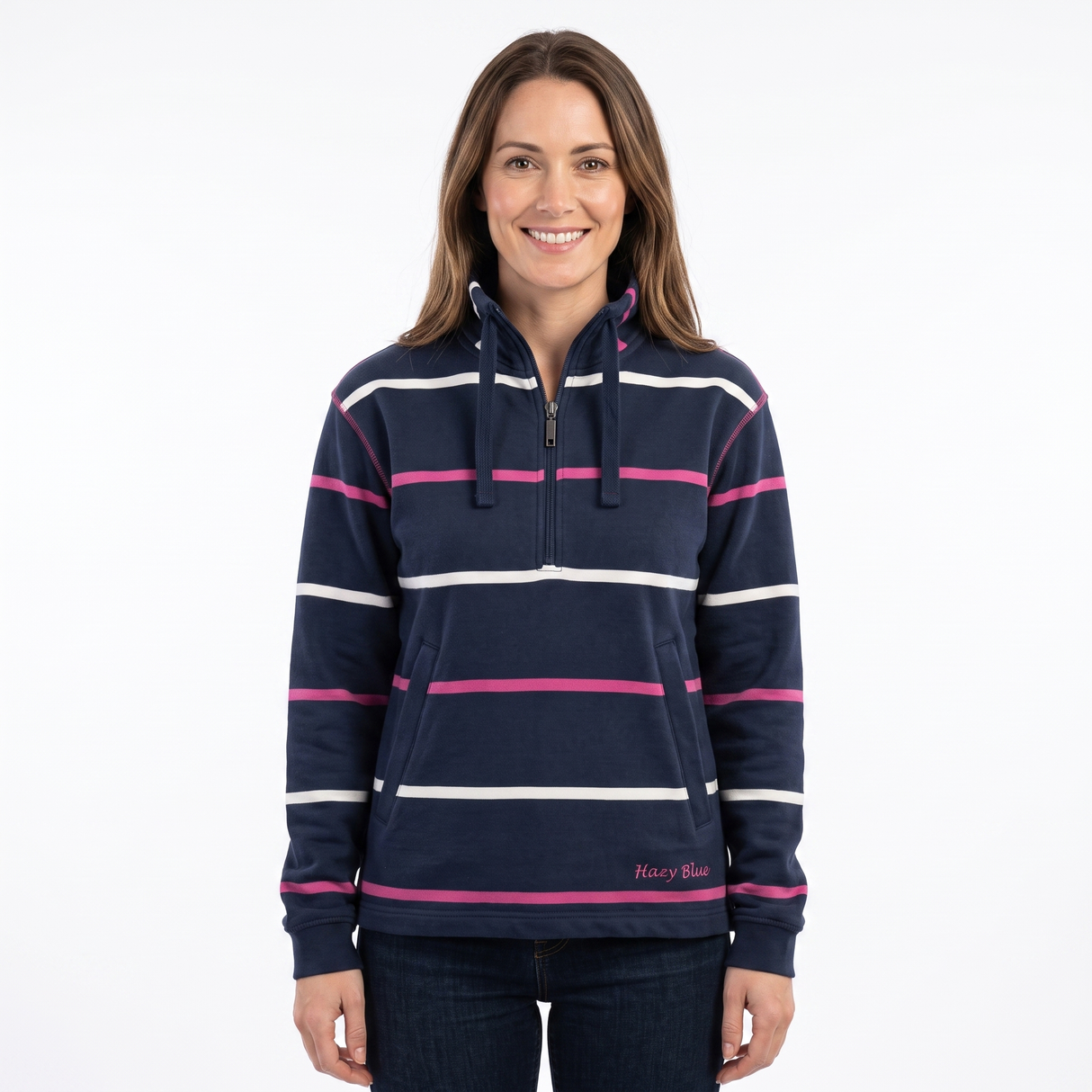 A woman modeling a navy blue half-zip hoodie with horizontal white and pink stripes, featuring a drawstring hood and a front kangaroo pocket, set against a plain white background.