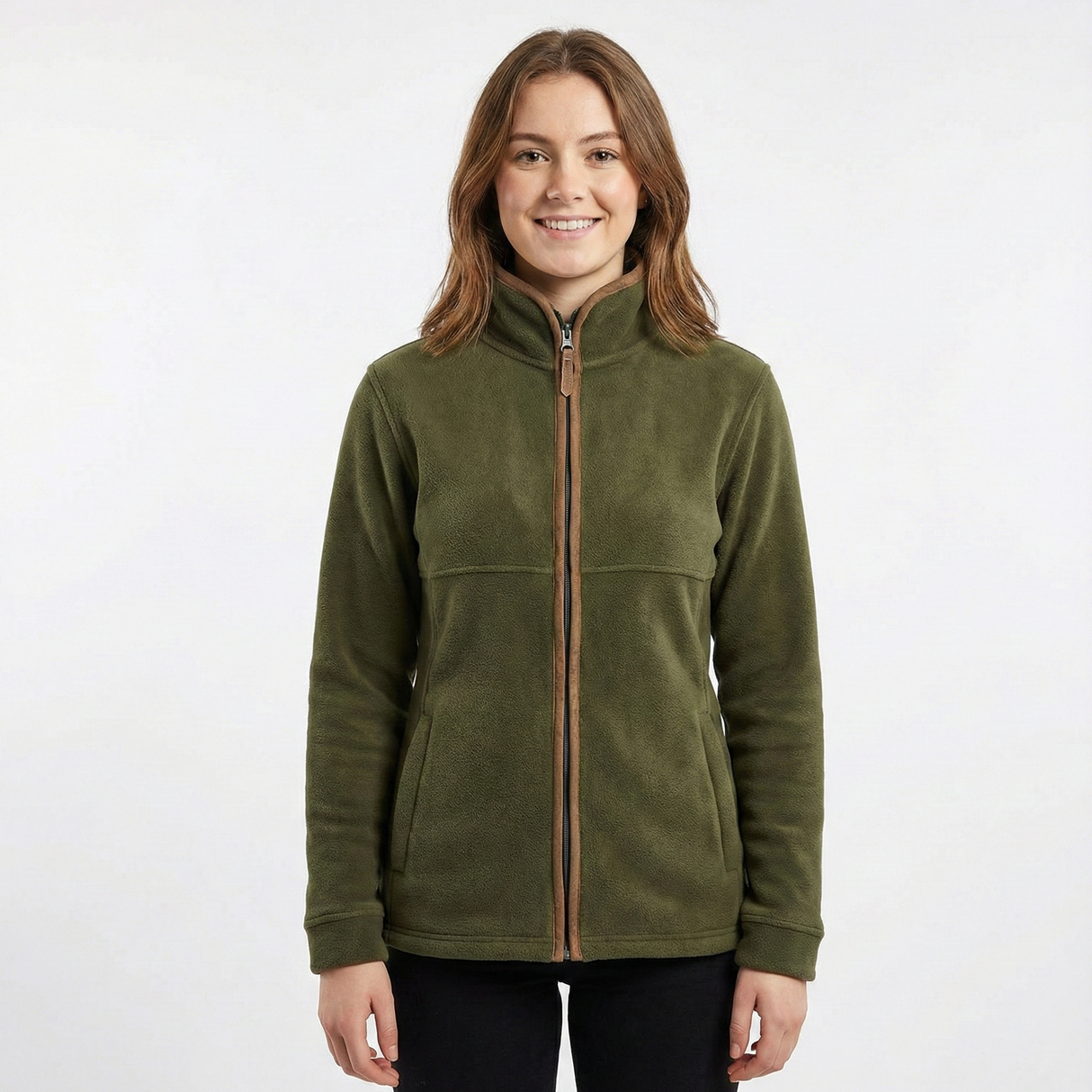 Woman wearing a green fleece jacket with a brown zipper on a white background