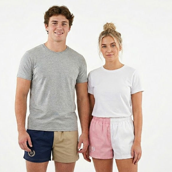 Two people standing side by side wearing casual clothing on a white background