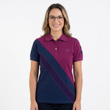 Woman wearing a purple and navy striped polo shirt on a white background