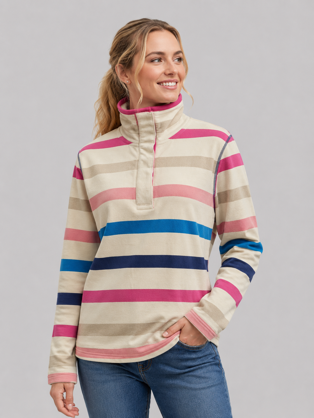 Woman wearing a striped pullover with a gray background