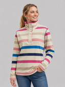 Woman wearing a striped pullover with a gray background
