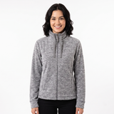 A woman wearing a heather gray zip-up fleece jacket with a stand collar, shown against a plain white studio background.