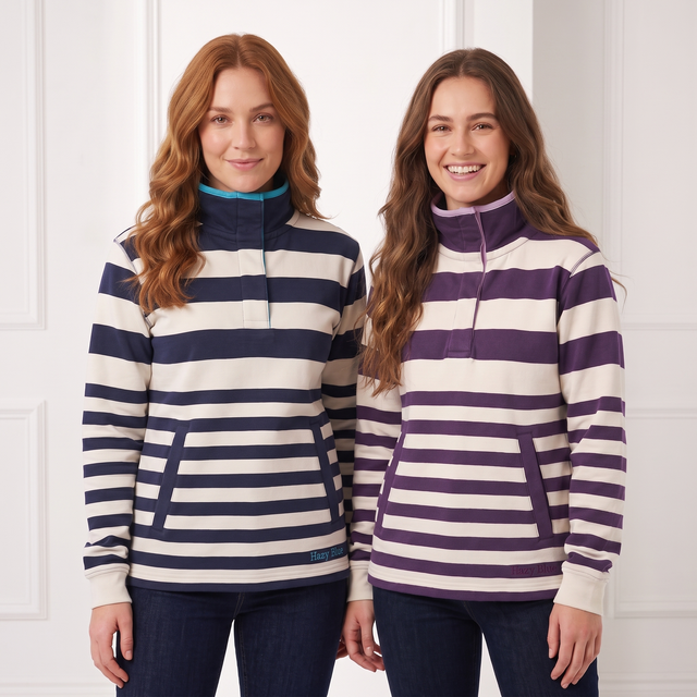 Two women modeling long-sleeve quarter-zip pullovers with horizontal stripes. The woman on the left wears a navy and cream striped pullover, and the woman on the right wears a purple and cream striped pullover.