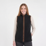 Woman wearing a black vest with a brown zipper on a white background