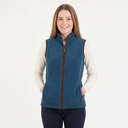 Woman wearing a blue fleece vest with a white background