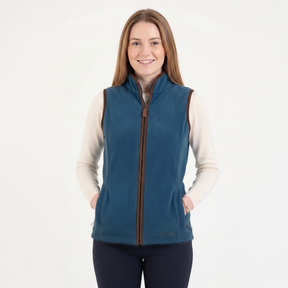 Woman wearing a blue fleece vest with a white background