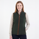 Woman wearing a green vest with a beige shirt underneath on a white background