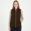 Woman wearing a brown vest over a beige long-sleeve shirt on a white background