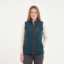 Woman wearing a teal vest over a cream shirt on a white background