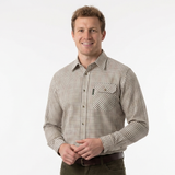 Man wearing a checkered shirt and green pants on a white background