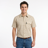 Man wearing a plaid short-sleeve shirt and jeans on a white background